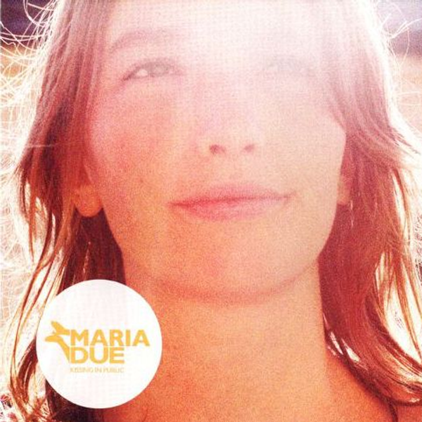 Sunlit closeup portrait of Maria Due and text with the album title 